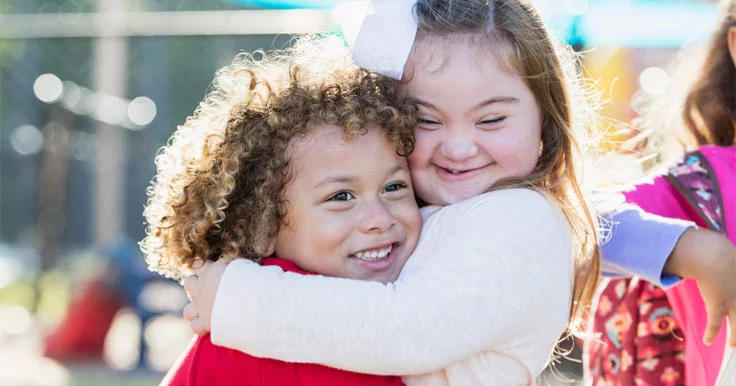 Happy Athletic Friends Hugging Each Other And Smiling. Girls Are