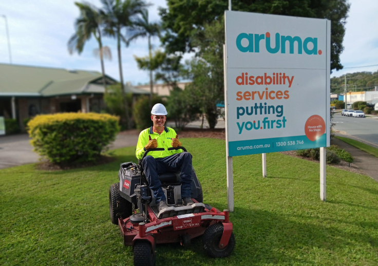 max from arumas facility management team on the ride on lawn mower.